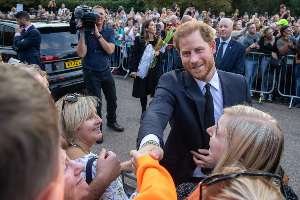 Prince Harry, the Duke of Sussex, greets well-wishers on the Long Walk outside Windsor Castle on 10th September 2022 in Windsor, United Kingdom. Crowds gathered to pay tribute to Queen Elizabeth II, the UK's longest-serving monarch, who died at Balmoral aged 96 on 8th September 2022 after a reign lasting 70 years. (photo by Mark Kerrison/In Pictures via Getty Images)