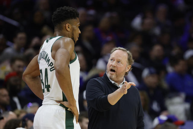 PHILADELPHIA, PENNSYLVANIA - MARCH 29: Head coach Mike Budenholzer of the Milwaukee Bucks (R) speaks with Giannis Antetokounmpo #34 during the third quarter against the Philadelphia 76ers at Wells Fargo Center on March 29, 2022 in Philadelphia, Pennsylvania. NOTE TO USER: User expressly acknowledges and agrees that, by downloading and or using this photograph, User is consenting to the terms and conditions of the Getty Images License Agreement. (Photo by Tim Nwachukwu/Getty Images)