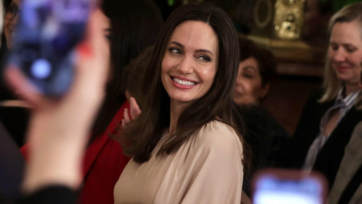 WASHINGTON, DC - MARCH 16:  Actress Angelina Jolie attends an event marking the reauthorization of the Violence Against Women Act at the East Room of the White House on March 16, 2022 in Washington, DC. President Joe Biden, who helped write the original piece of the legislation in 1994 when he was a senator on Capitol Hill, presided over the event. (Photo by Alex Wong/Getty Images)