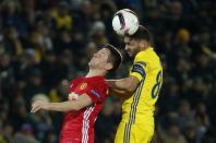 <p>FC Rostov’s Aleksandru Gatcan in action with Manchester United’s Ander Herrera </p>