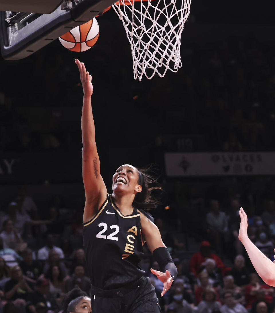 Las Vegas Aces forward A'ja Wilson (22) lays up the ball against the Minnesota Lynx during the second half of a WNBA basketball game Sunday, June 19, 2022, in Las Vegas. (Chase Stevens/Las Vegas Review-Journal via AP)
