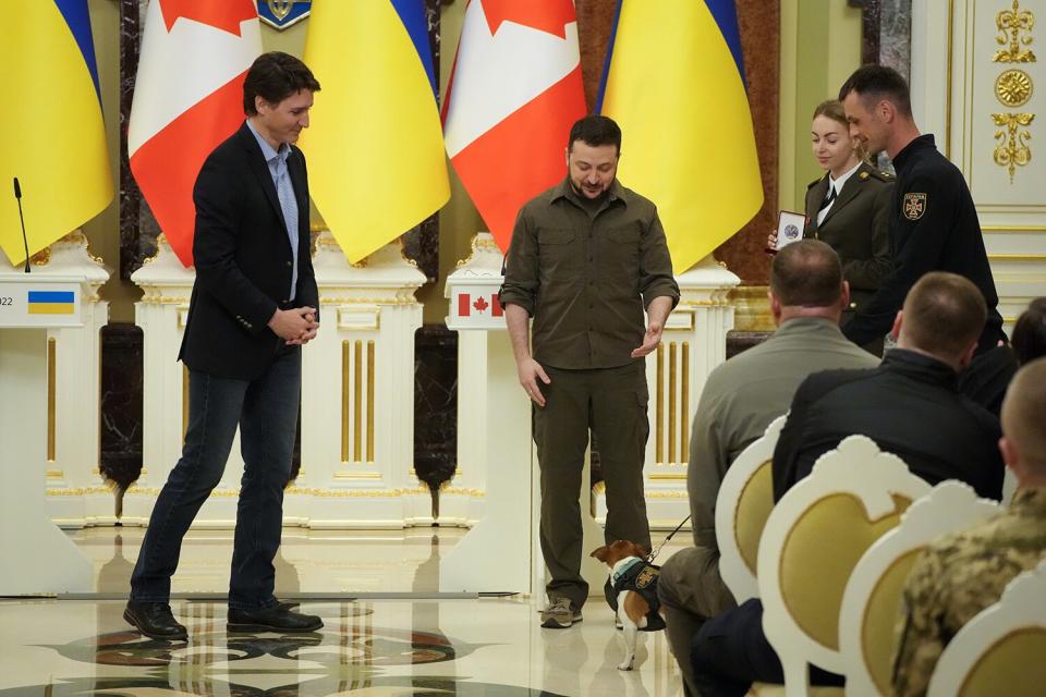 Ukrainian President Volodymyr Zelenskyy, center, and Canadian Prime Minister Justin Trudeau, attend an award ceremony for a Ukrainian sapper and his legendary dog Patron in Kyiv, Ukraine