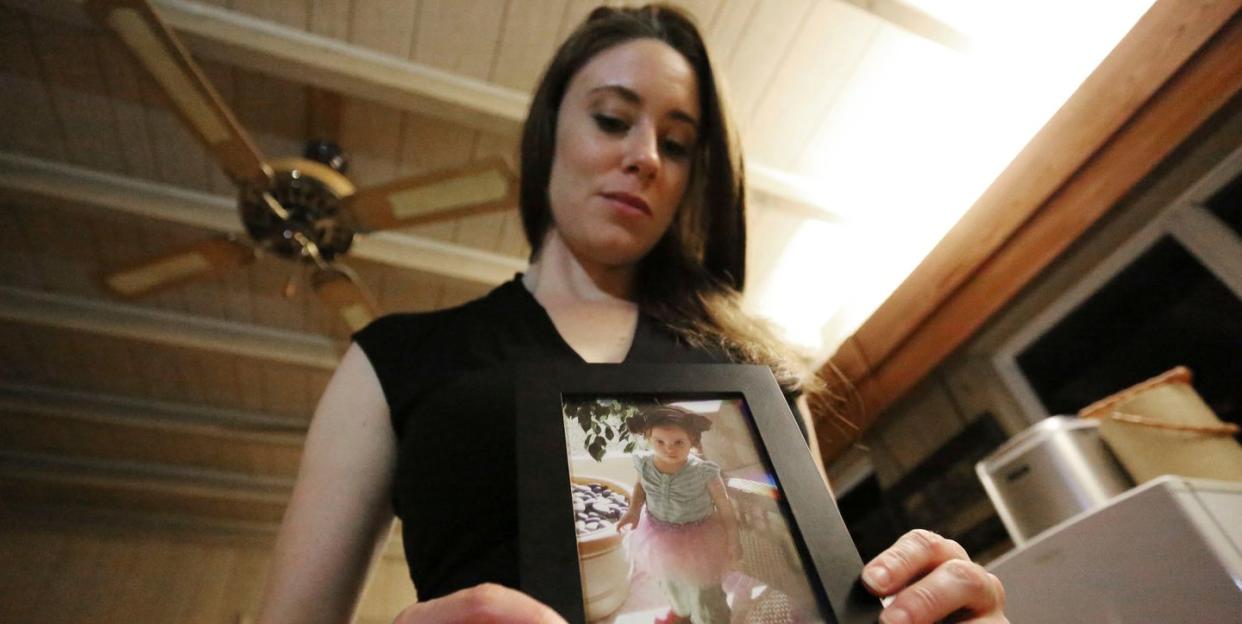 mandatory credit photo by apshutterstock 8488533a
casey anthony poses with a photo of her daughter caylee during an interview in her west palm beach, fla, home anthony, 30, opens up for the first time on the record about the death of her daughter in 2008
casey anthony, west palm beach, usa   13 feb 2017