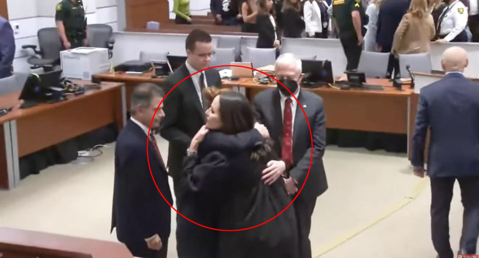 Judge Elizabeth Scherer hugs members of the prosecution after Nikolas Cruz was sentenced.