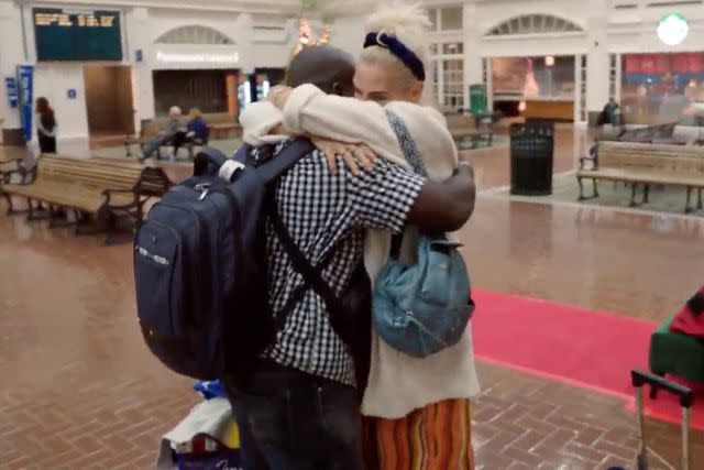 <p>TLC</p> Michael and Angela hug as he lands in Georgia after getting his U.S. visa