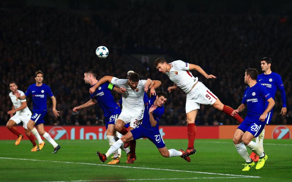 Edin Dezeko scores the second of his two goals for Roma in the 3-3 draw with Chelsea last October - PA