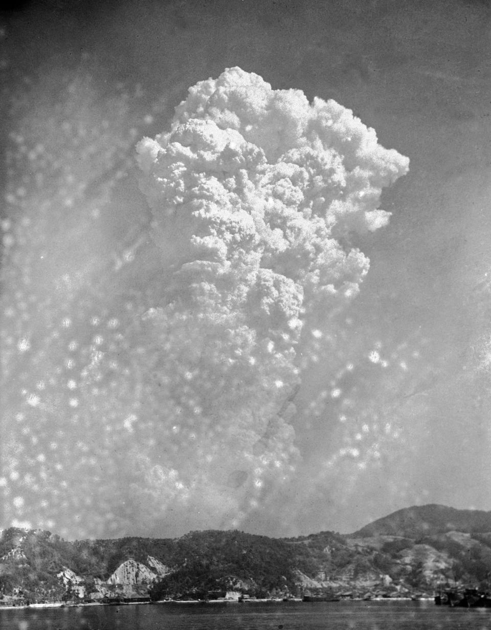 Smoke rises around 20,000 feet above Hiroshima, Japan, after the first atomic bomb was dropped on Aug. 6, 1945. 