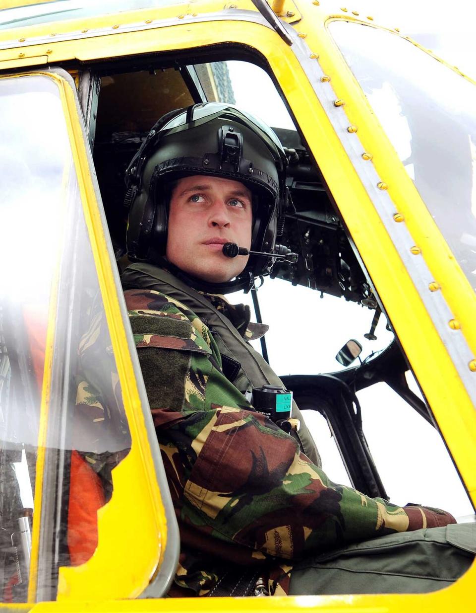 In a file picture taken on March 31, 2011 Britain's Prince William is pictured at the controls of a Sea King helicopter during a training exercise at Holyhead Mountain, having flown from RAF Valley in Anglesey, north Wales. Britain's Prince William will be deployed to the Falkland Islands early 2012 on a six-week tour of duty as a search and rescue helicopter pilot, the Royal Air Force said on November 10, 2011.