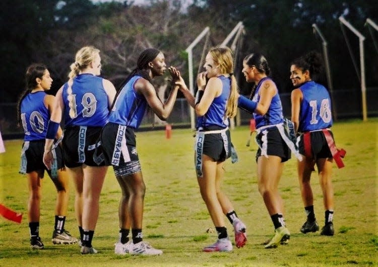 The Park Vista flag football team celebrates a successful down. Returning from a region final run in 2022, this spring's 14-3 run ended in the first-round of playoffs.