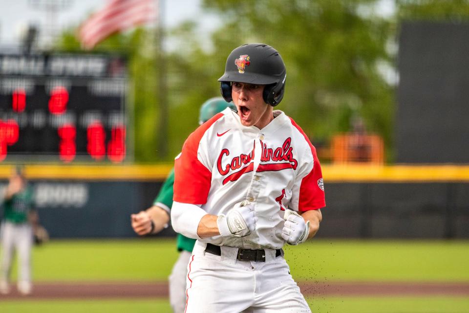 Ball State's Zach Cole celebrates after scoring during a Mid-American Conference Tournament game against Ohio at Ball Diamond at First Merchants Ballpark Thursday, May 26, 2022.