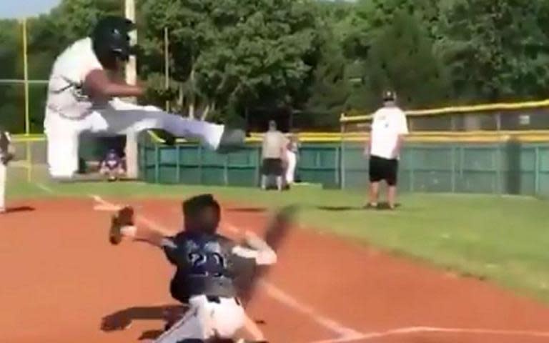 Little Leaguer Mason Cherry goes airborne to scorey a wild run. (@WarriorsB8sball on Twitter)