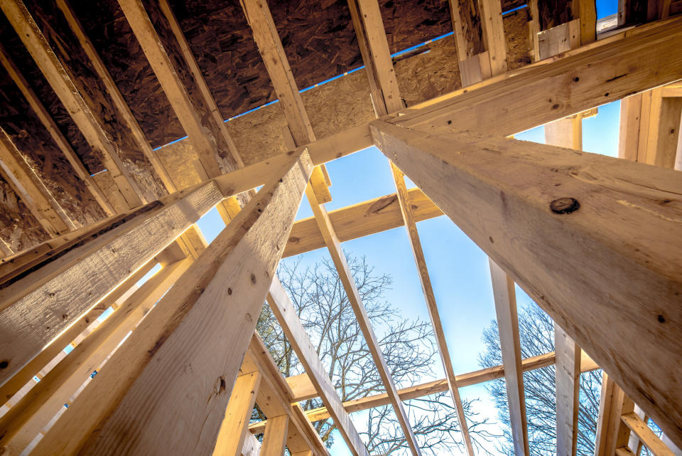 Wood building frame structure on new development site.