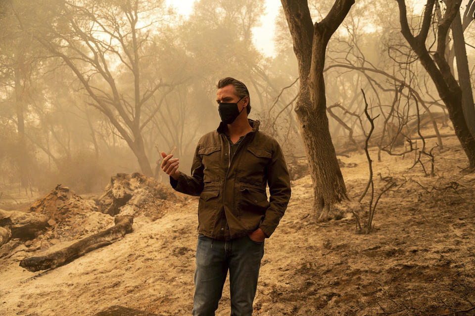 Gov. Gavin Newsom tours the North Complex Fire zone in Butte County on Friday, Sept. 11, 2020, outside of Oroville, Calif. Newsom has declared a statewide emergency due to the widespread fires and extreme weather conditions, and secured a Presidential Major Disaster Declaration to bolster the state's emergency response to the Northern California wildfires. (Paul Kitagaki Jr./The Sacramento Bee via AP, Pool)