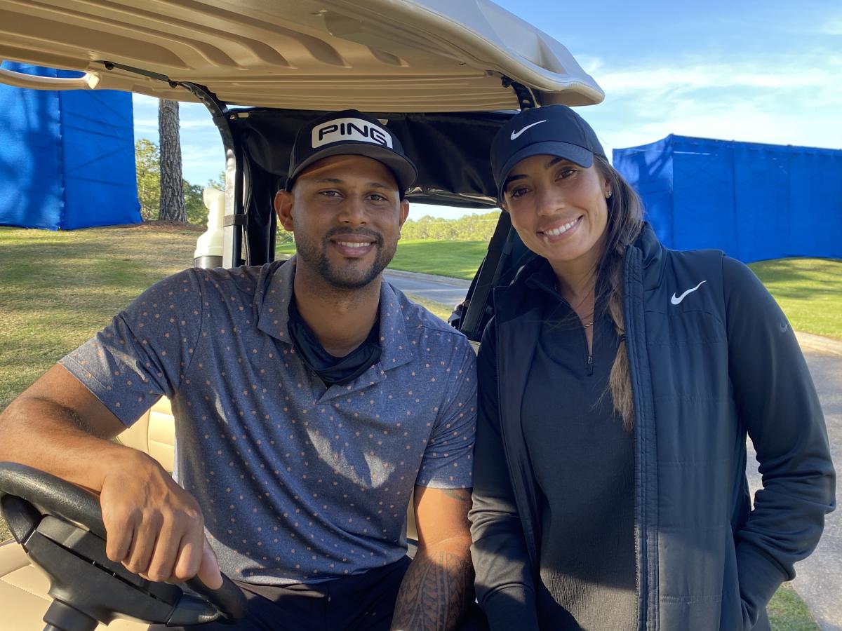 Professional baseball player Aaron Hicks, right, and his caddie Cheyenne  Woods, niece of golfer Tiger Woods, wait at the 17th tee as In Gee Chun  walks away during the final round of