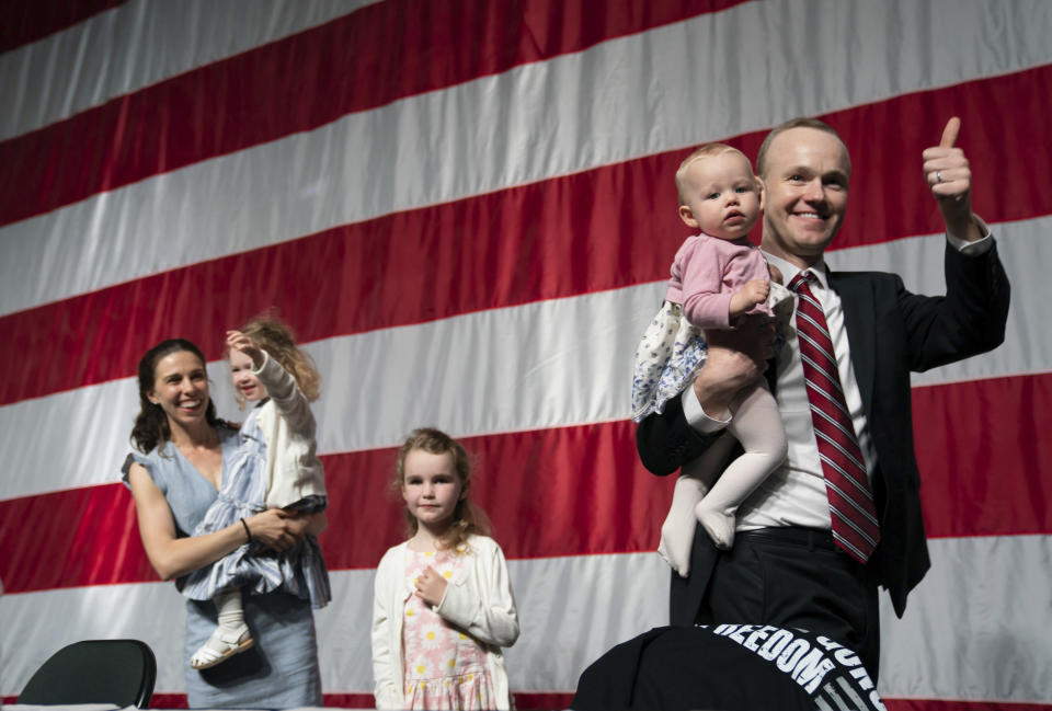 GOP attorney general candidate Jim Schultz leaves the stage with his wife Molly and their children during the first day of the Minnesota State Republican Convention, Friday, May 13, 2022, at the Mayo Civic Center in. Rochester, Minn. (Glen Stubbe/Star Tribune via AP)