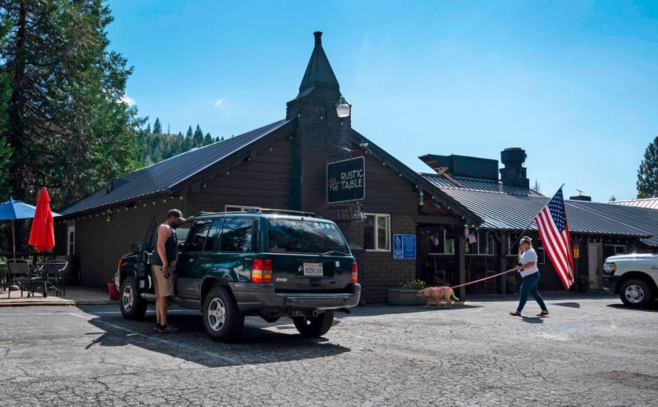 Customers at Rustic Table Restaurant in Emigrant Gap walk to the outside dining area earlier this month. 