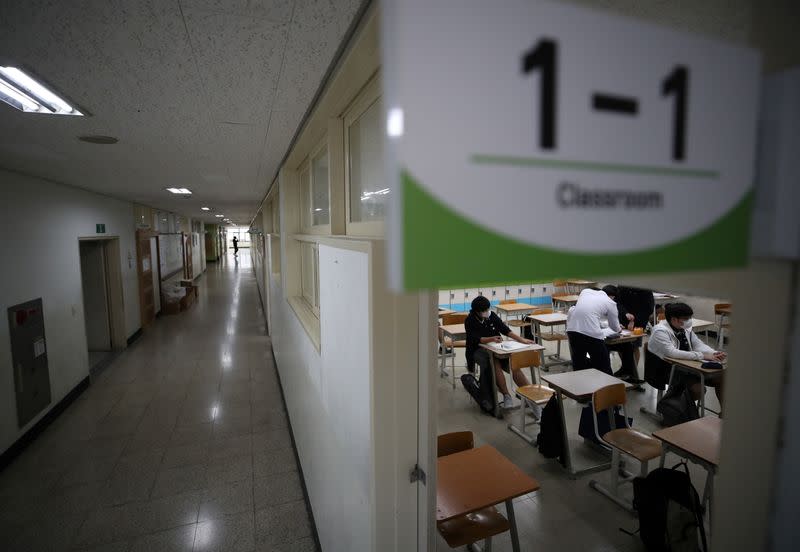 High school students prepare for a class amid the coronavirus disease (COVID-19) pandemic at a high school in Seoul