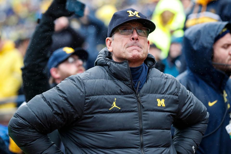 Michigan coach Jim Harbaugh and the Wolverines are 7-0 halfway through the season.