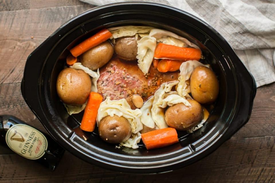<p>The Magical Slow Cooker</p><p>Guinness beer and a touch of brown sugar flavor this corned beef.</p><p><strong>Get the recipe: <a href="https://www.themagicalslowcooker.com/slow-cooker-guinness-corned-beef-and-cabbage/" rel="nofollow noopener" target="_blank" data-ylk="slk:Slow Cooker Guinness Corned Beef and Cabbage;elm:context_link;itc:0;sec:content-canvas" class="link ">Slow Cooker Guinness Corned Beef and Cabbage</a></strong></p>