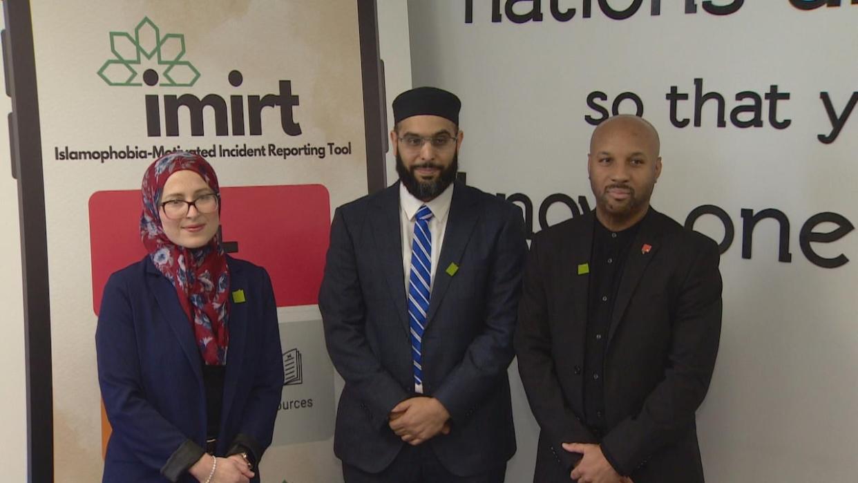Canada's first anti-Islamophobia representative Amira Elghawaby (left), Imam Ibrahim Hindy (middle) and Uthman Quick, the director of communications for the National Council of Canadian Muslims (right), announce the launch of Islamophobia-Motivated Incident Reporting Tool. (Igor Petrov/CBC - image credit)