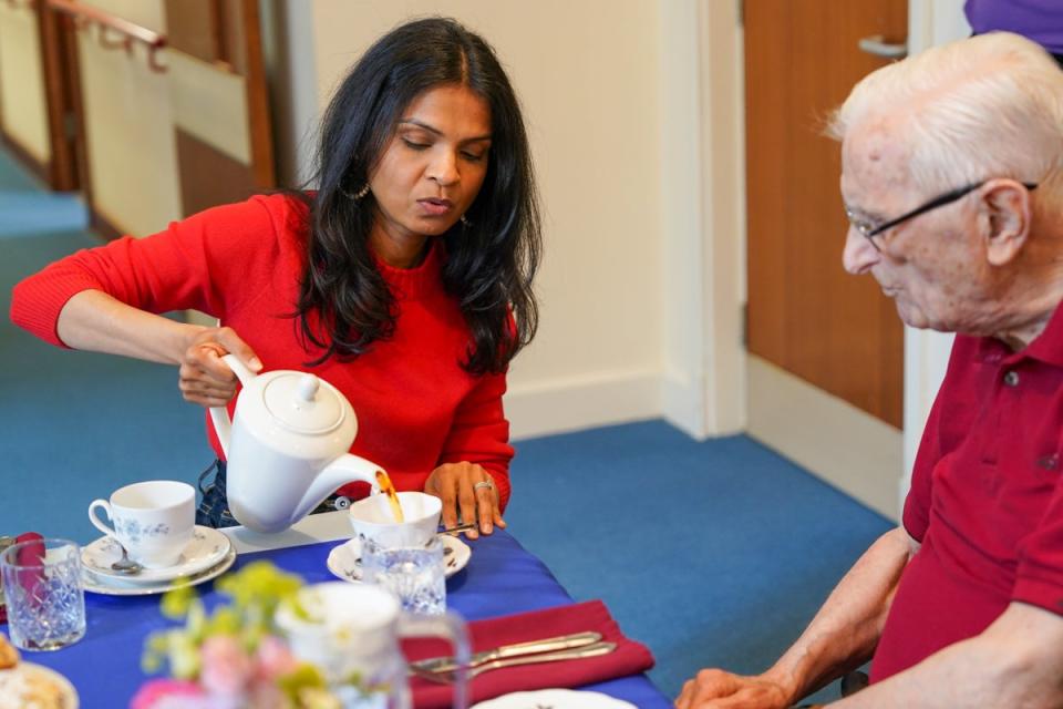 The prime minister’s wife pours the tea (PA)