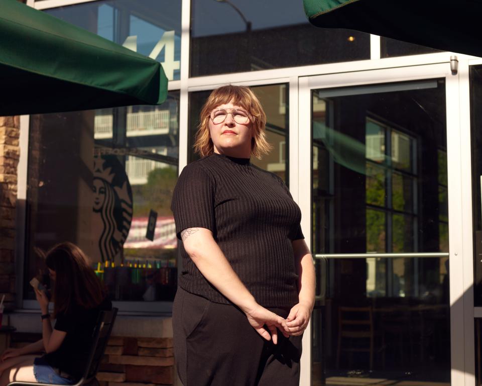 Lindsey Price stands outside a Starbucks in Seattle.