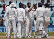 Cricket - India v New Zealand - Second Test cricket match - Eden Gardens, Kolkata - 01/10/2016. India's Mohammed Shami celebrates with teammates after taking the wicket of New Zealands's Tom Latham. REUTERS/Rupak De Chowdhuri