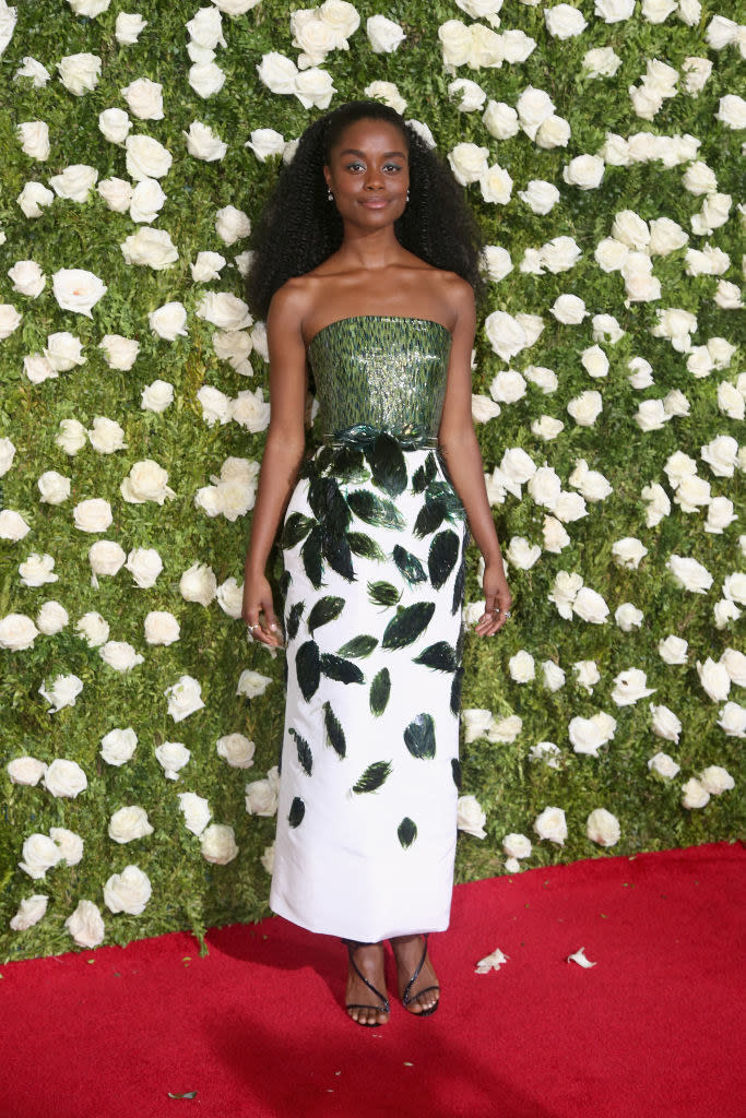 This dress floors me. The texture of the beading on the top is just *chef's kiss.* Plus, intentional or not, she suits the backdrop remarkably well.  