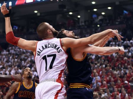 May 23, 2016; Toronto, Ontario, CAN; Raptors center Jonas Valanciunas (17) battles for position under the basket with Cleveland Cavaliers forward Kevin Love (0) in game four of the Eastern conference finals of the NBA Playoffs at Air Canada Centre. Mandatory Credit: Dan Hamilton-USA TODAY Sports