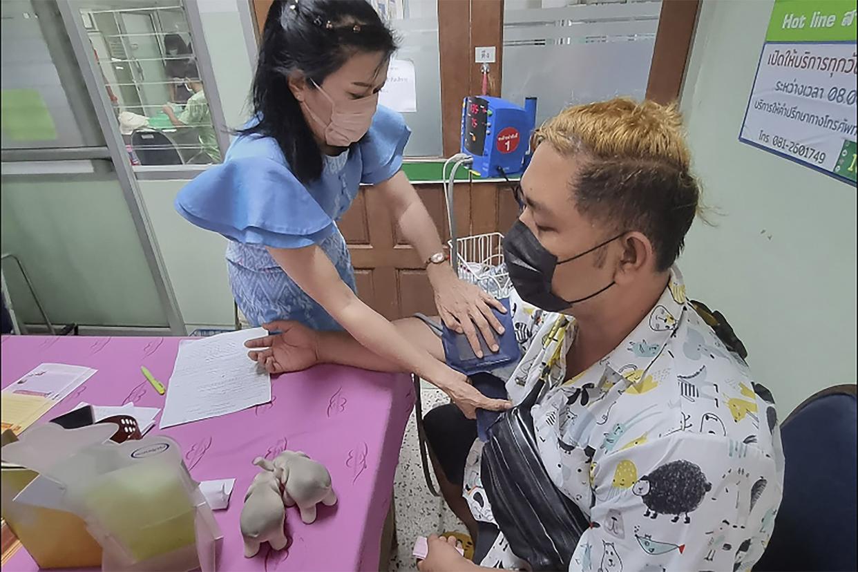 A resident donates blood at the local hospital for victims of an attack at a daycare center, Thursday, Oct. 6, 2022, in the town of Nongbua Lamphu, northeastern Thailand.