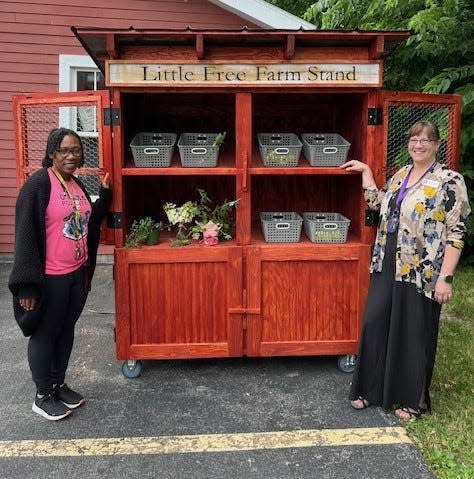 Alexis Lawrence, adult librarian at Wood Library, and Cyndi Fordham, administrative assistant, staff the Little Free Farm Stand, now open at the library, 134 N. Main St., Canandaigua.