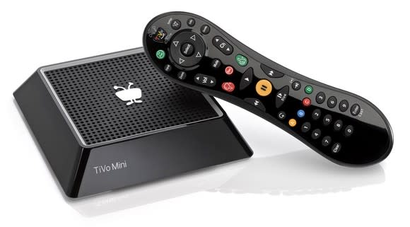 TiVo mini device with hand-held remote.