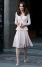 <p>Kate's visit to the National Portrait Gallery to see her Vogue cover saw her don a pale pink peplum dress by Alexander McQueen. Carrying the nude theme through to her shoes and bag, the Duchess was a feminine vision. <i>[Photo: PA]</i> </p>