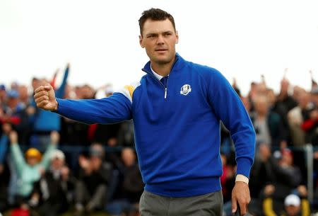 European Ryder Cup player Martin Kaymer celebrates his putt to halve the first hole during the 40th Ryder Cup singles matches at Gleneagles in Scotland September 28, 2014. REUTERS/Phil Noble