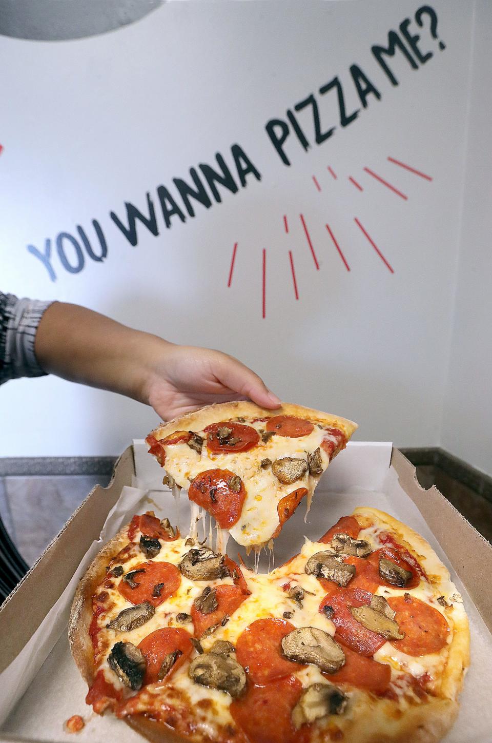 A pepperoni and mushroom pizza from Twisted Tomato Pizzeria in Stow.