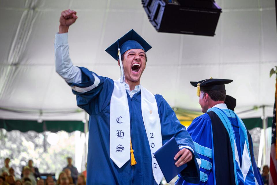 Lucas Federle celebrates after receiving his diploma during the Cohasset High School graduation ceremony at the South Shore Music Circus on Saturday, June 4, 2022.