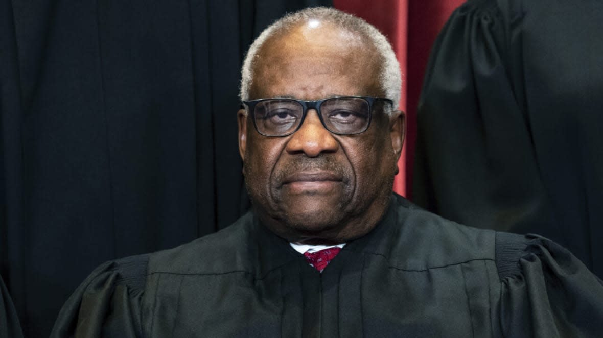 Supreme Court Justice Clarence Thomas sits during a group photo at the Supreme Court in Washington, April 23, 2021. Thomas has requested an extension to disclose gifts he’s received while serving on the Supreme Court. (Erin Schaff/The New York Times via AP, Pool)