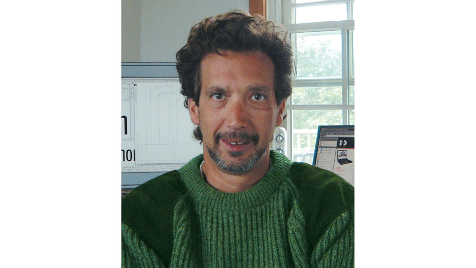 David Berlow headshot with computer behind him