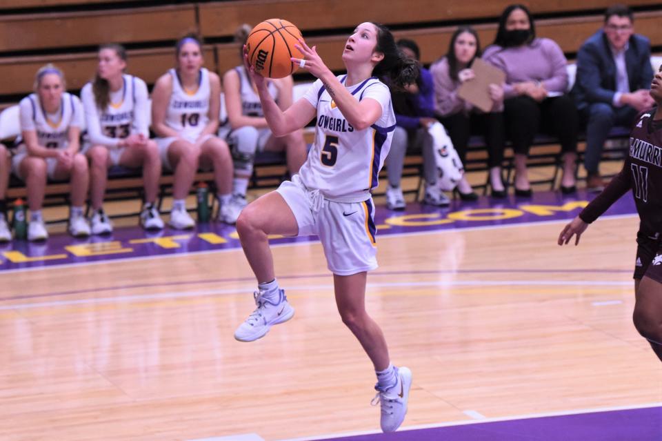 Hardin-Simmons' Brittany Schnabel (5) goes up for a layup during Saturday's ASC game against McMurry at the Mabee Complex. Schnabel made four 3-pointers and scored a team-high 20 points as the No. 21 Cowgirls earned the 88-69 victory.