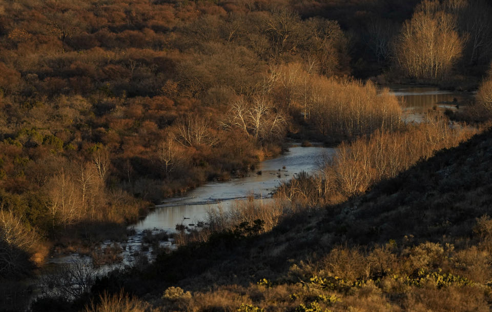 A portion of the Devil's River is seen on a ranch near Del Rio, Texas, Thursday, Feb. 16, 2023. When a China-based developer decided to erect dozens of wind turbines in the area, each the size of the tallest skyscraper in San Antonio, across thousands of scrubby acres fed by one of America's cleanest waterways, local landowners made it their mission to stop the project. (AP Photo/Eric Gay)