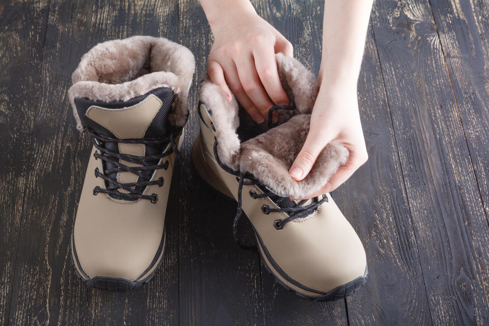 Winter female boot with fur over white