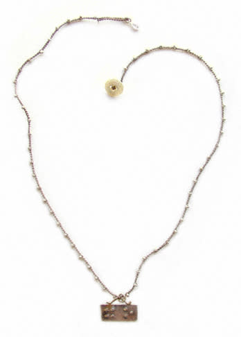 Onu Braille Hug & Kiss Pendant Necklace, $140, at onujewelry.com