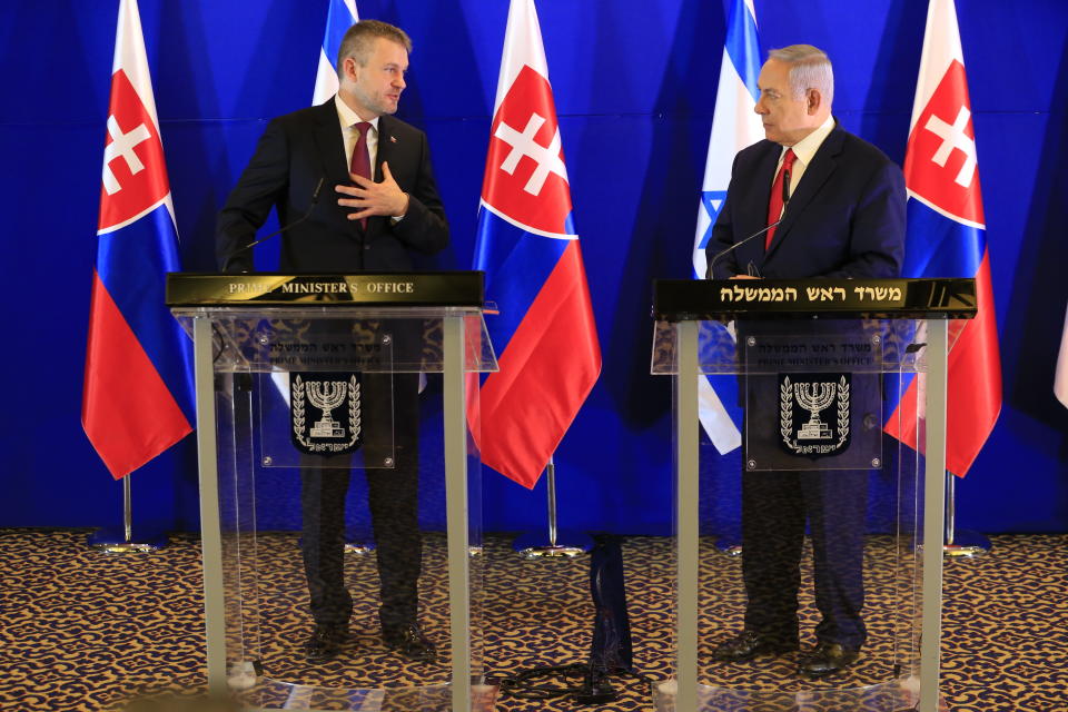 Slovakia's Prime Minister Peter Pellegrini, left, speaks as Israeli Prime Minister Benjamin Netanyahu listens after their meeting in Jerusalem, Tuesday, Feb. 19, 2019. (AP Photo/Ariel Schalit, Pool)
