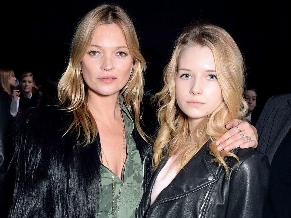 <p>David M. Benett/Getty </p> Kate Moss and her sister Lottie Moss attend the Topshop Unique show at London Fashion Week AW14 at Tate Modern on Feb. 16, 2014 in London, England. 