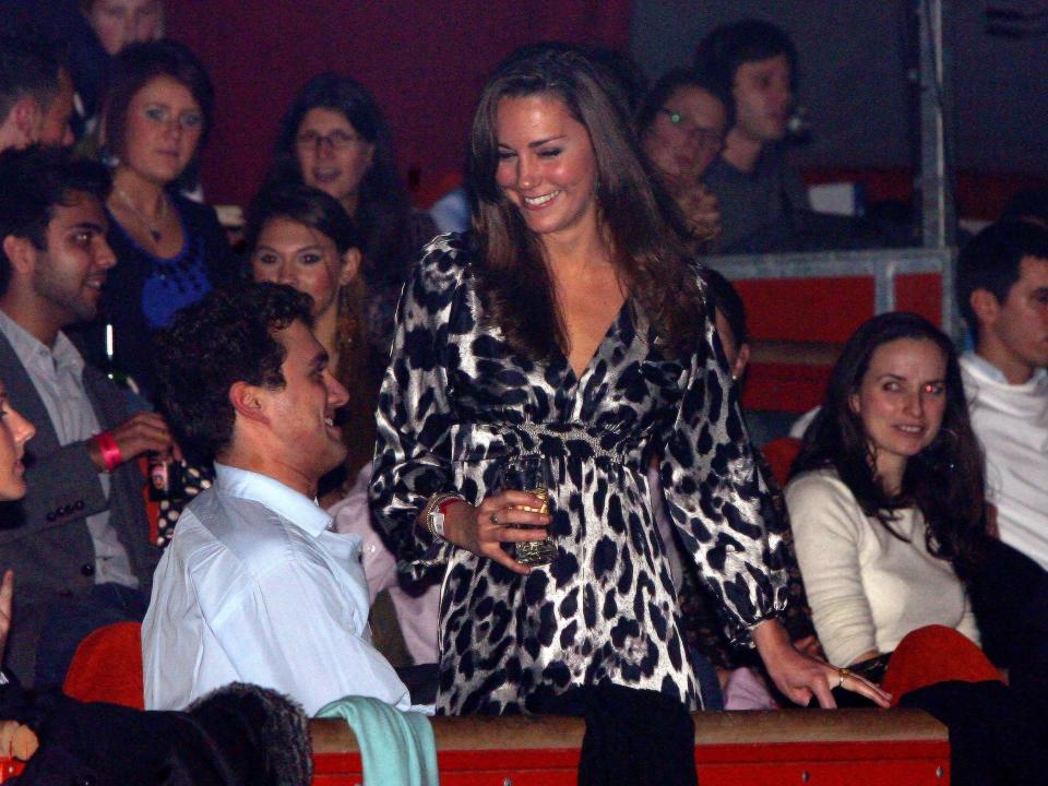 Kate Middleton at the circus wearing an animal print dress before royal life.