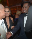 <p>Awkward! J.Lo’s then-boyfriend, Smart, left, shook hands with her ex-boyfriend, Diddy, at the 2013 affair. “This guy? Really?” Combs seems to be thinking. Expect Alex Rodriguez to be on Lopez’s arm at this year Globes. (Photo: Charley Gallay/Getty Images for Chopard) </p>