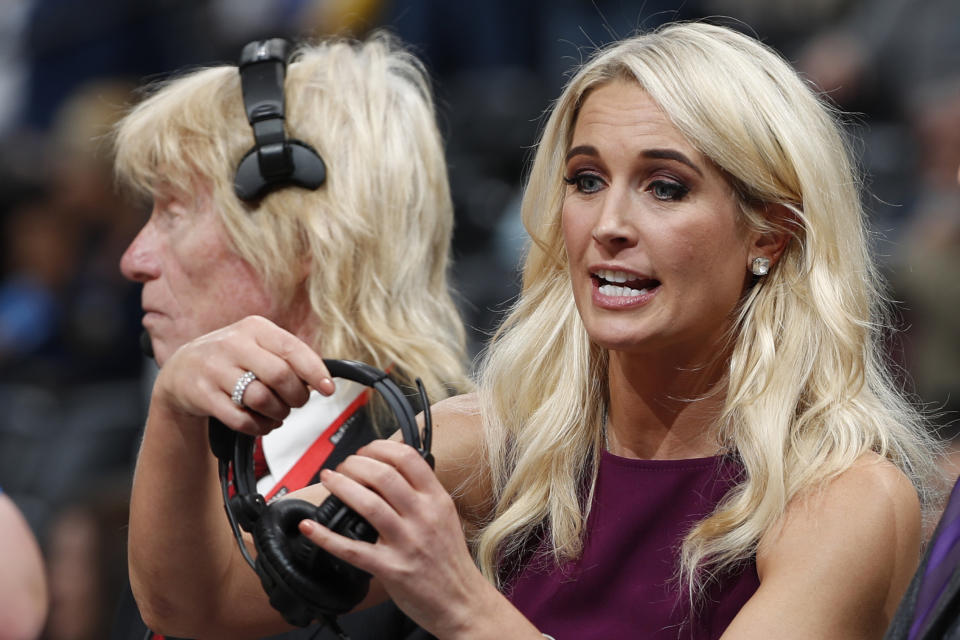 FILE - In this Nov. 9, 2018, file photo, Sarah Kustok, television color analyst for the Brooklyn Nets, prepares for the team's NBA basketball game against the Denver Nuggets in Denver. Women are impacting every aspect of the NBA, from broadcasting booths, to officiating, coaching on the sidelines, front-office executives to ownership. (AP Photo/David Zalubowski, File)