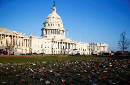 Activists install 7000 shoes on the lawn in front of the U.S. Capitol on Capitol Hill in Washington, U.S. March 13, 2018. REUTERS/Eric Thayer