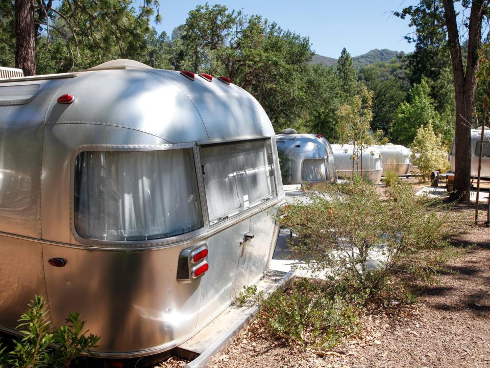 Autocamp Yosemite's Airstream suites by trees and walkways