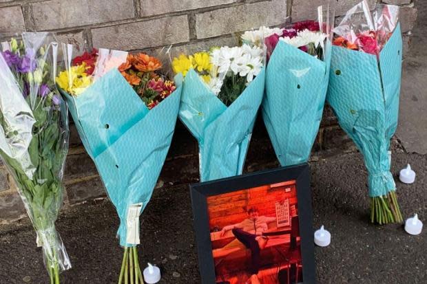 Flowers and tributes left at car park after teen dies in fall in town